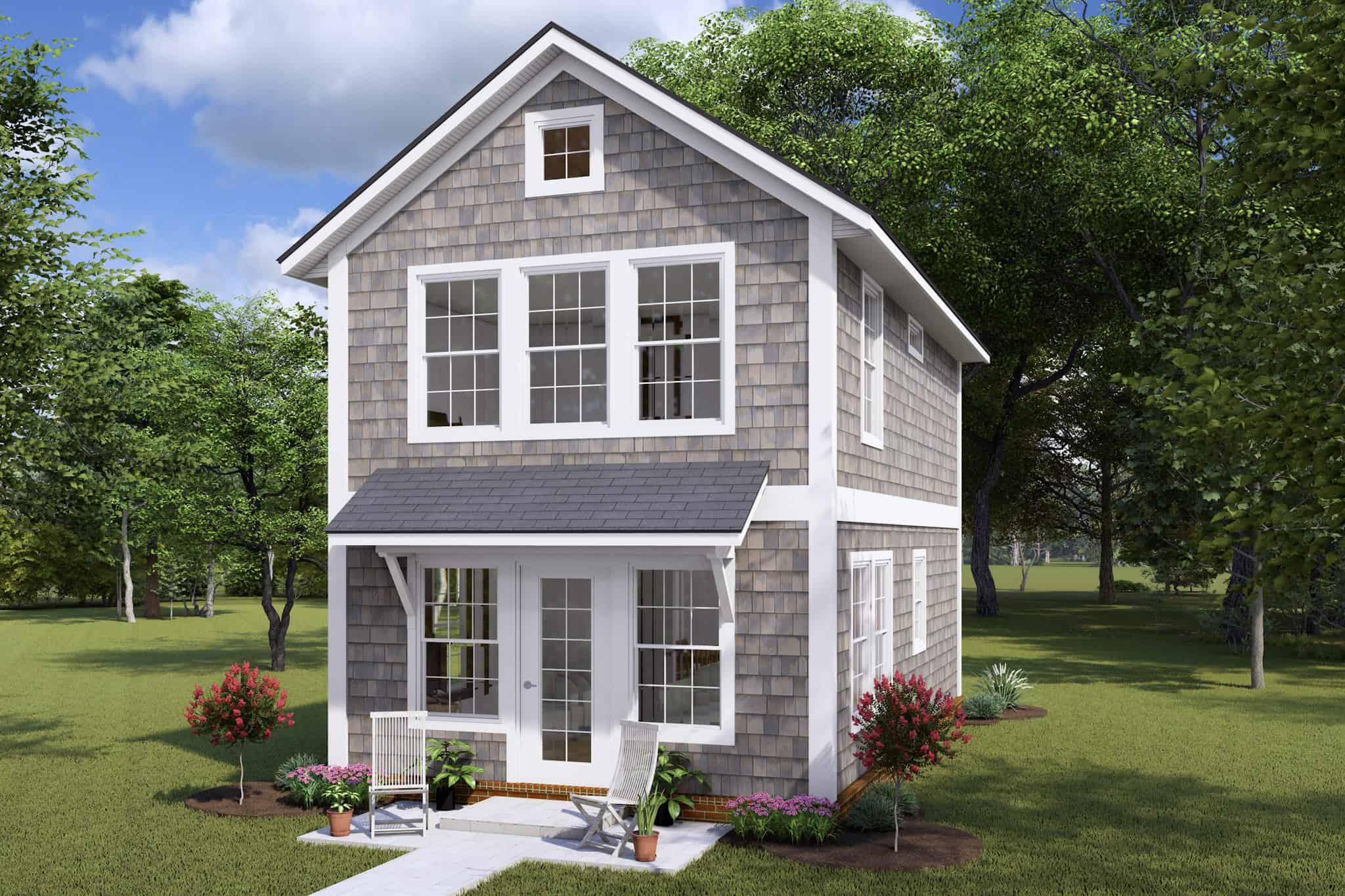 Front exterior of a 2-story, 896 sq ft shingle-style cottage with symmetrical windows, gable roof, and inviting front entry