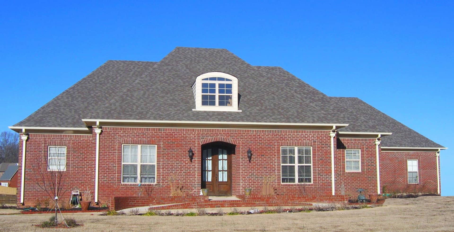 Front view of Country home (ThePlanCollection: House Plan #170-1584)