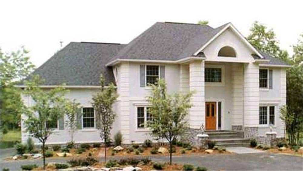 Front view of Colonial home (ThePlanCollection: House Plan #146-1129)