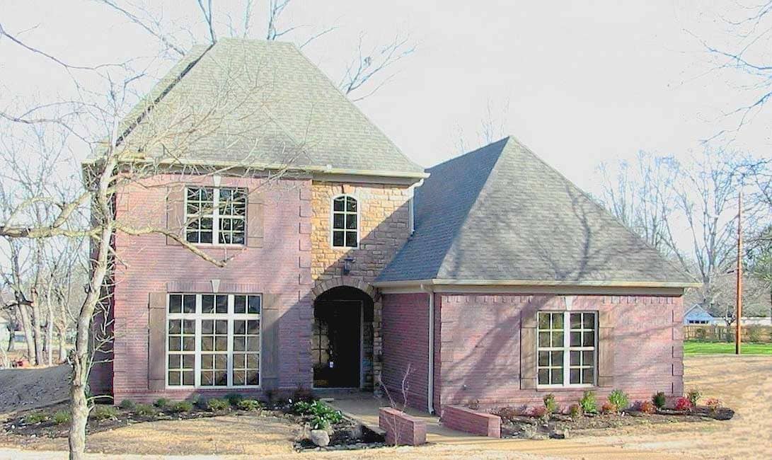 Front view of French home (ThePlanCollection: House Plan #170-1647)
